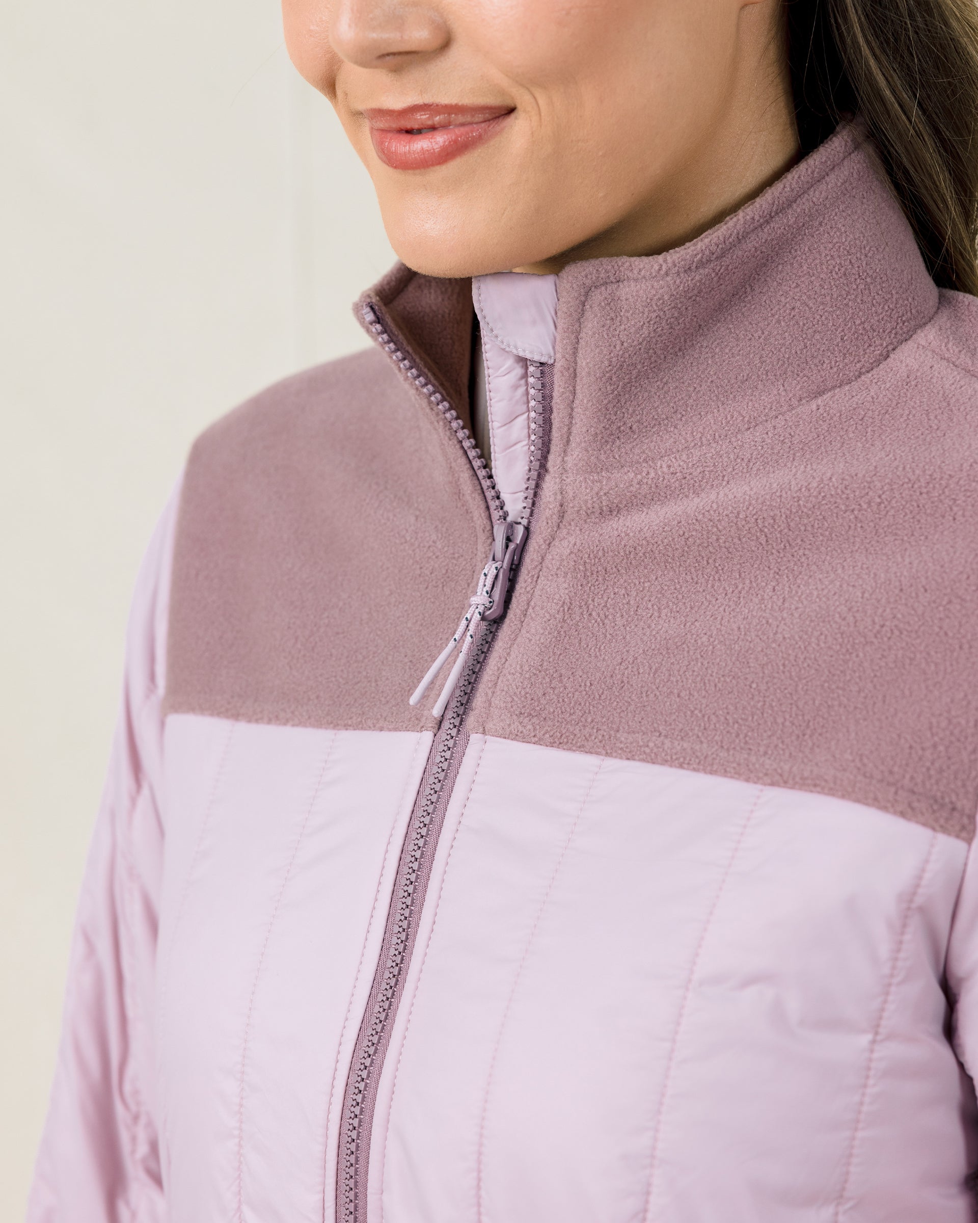 Close-up of the Taylor Jacket in Pink Dawn highlighting the full-zip closure