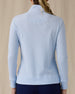 Women's Hills Quarter Zip in Lake, back view on model featuring a light blue waffle-knit quarter-zip pullover with mock neck collar and ribbed cuffs, paired with navy pants