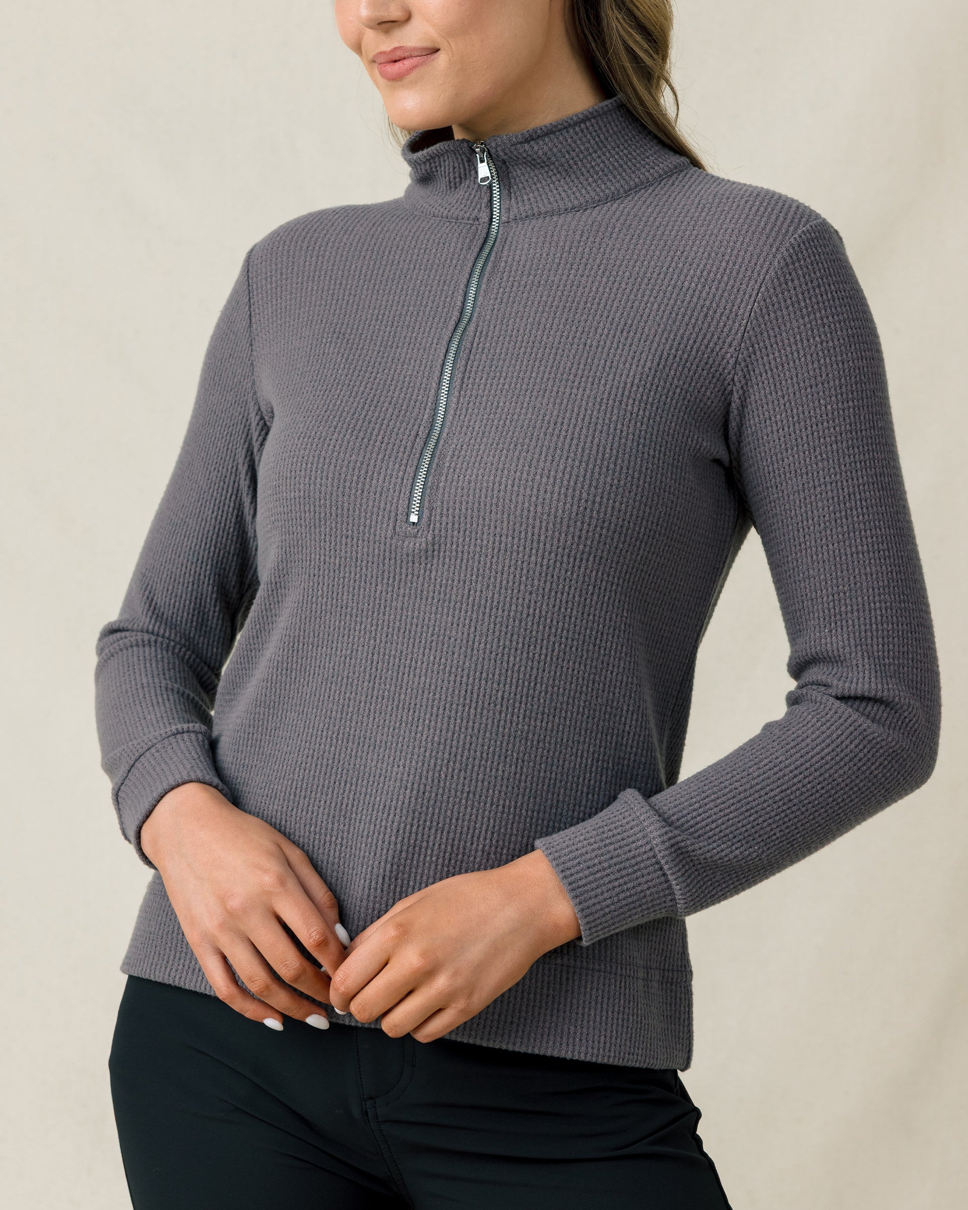 Close-up of the Hills Quarter Zip in Nightshade showing the textured waffle knit fabric, raised collar, and metal zipper.