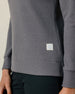 Close-up of the Hills Quarter Zip in Nightshade highlighting the waffle knit texture, banded hem, and Straight Down logo patch.