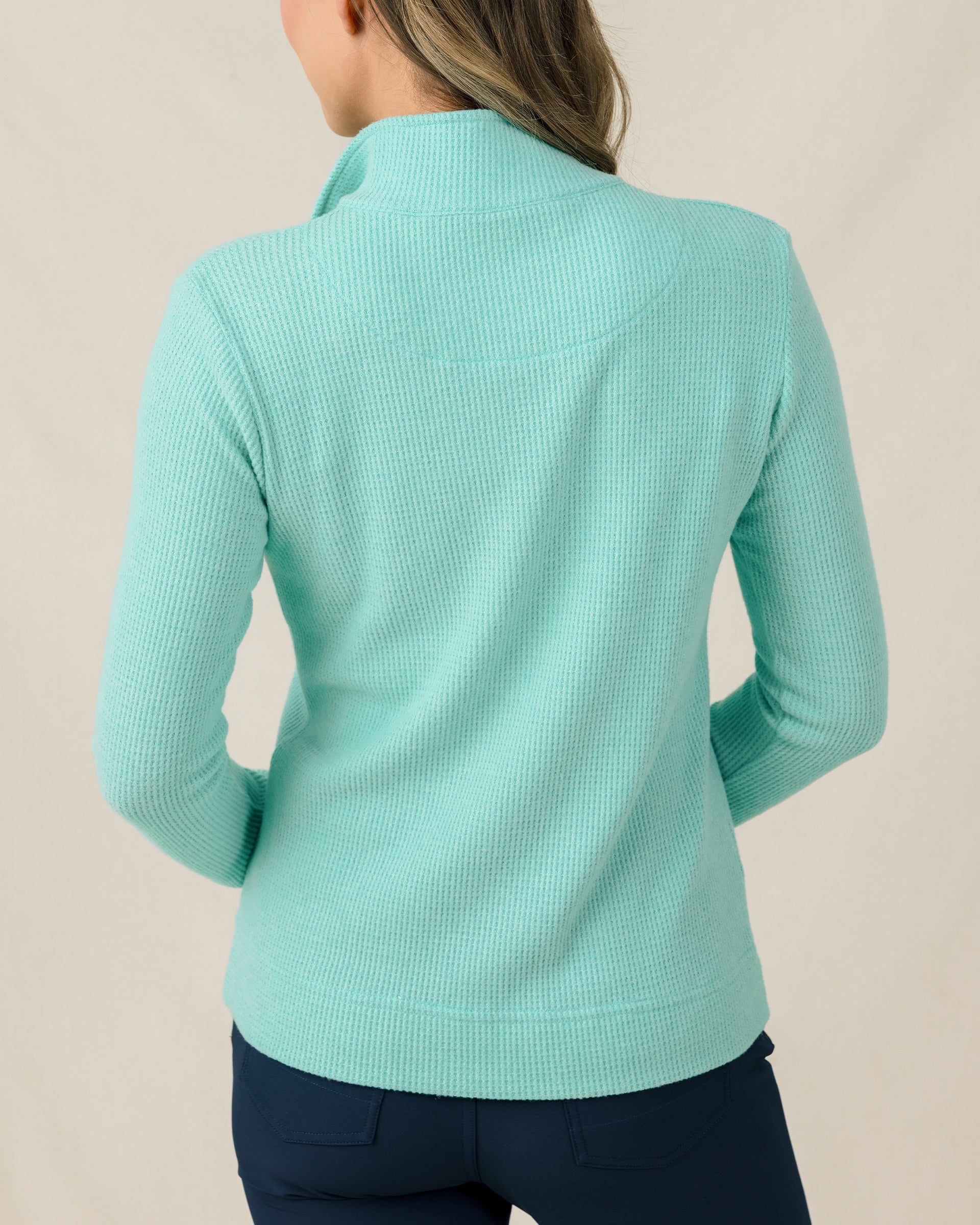Back view of the Hills Quarter Zip in Cascade featuring textured waffle-knit fabric and long sleeves