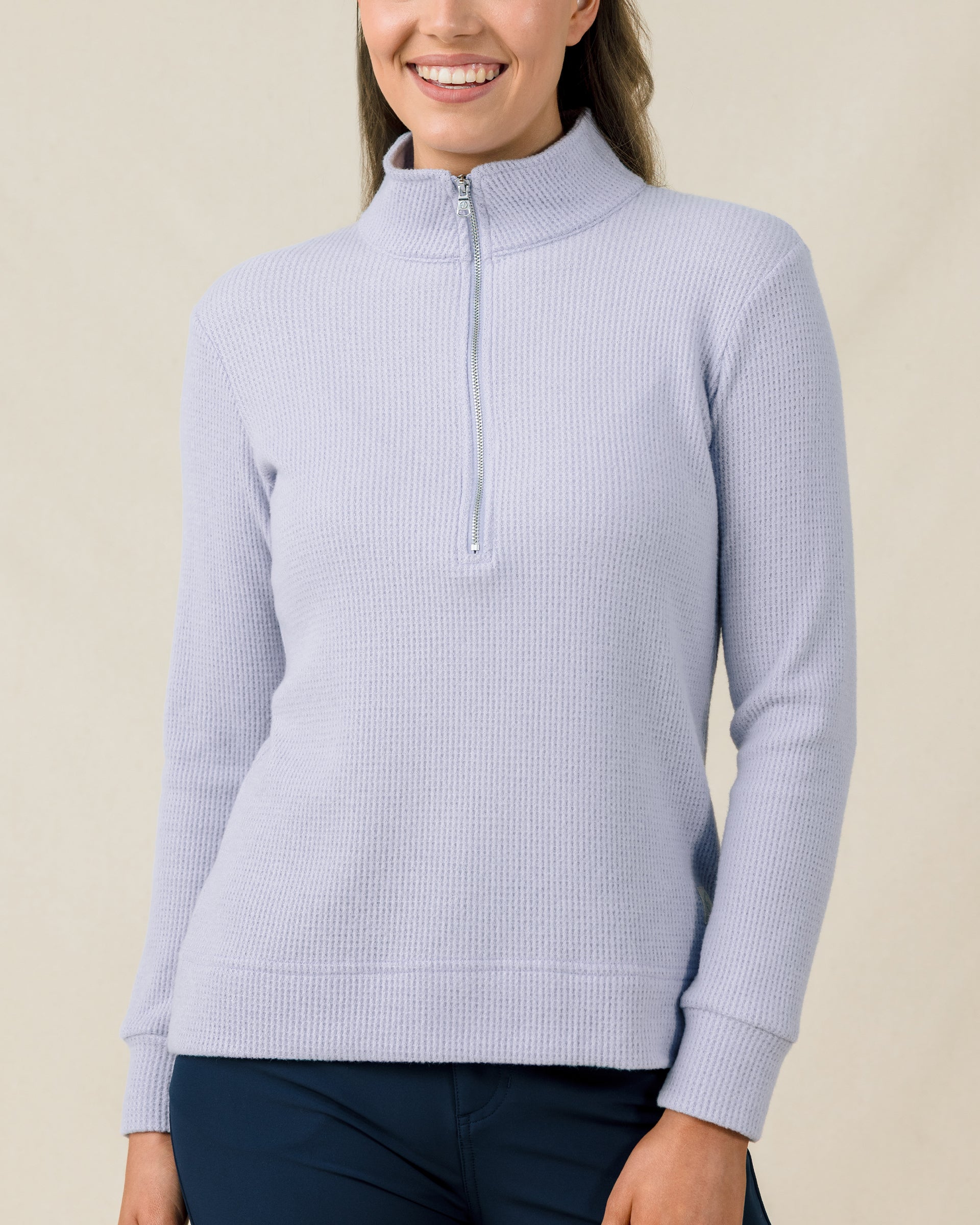 Close-up of the Straight Down Hills Quarter Zip in Cosmic Blue with the quarter zip fully closed and textured waffle knit fabric