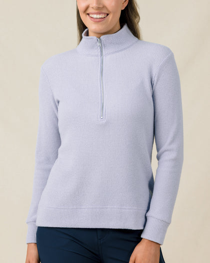 Close-up of the Straight Down Hills Quarter Zip in Cosmic Blue with the quarter zip fully closed and textured waffle knit fabric