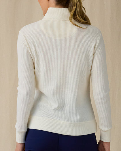 Women's Hills Quarter Zip in Cream, back view on model featuring a cream long sleeve quarter zip pullover with a waffle knit texture, paired with navy pants