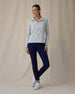 Women's Hills Quarter Zip in New Heather, front full-length view featuring a light heather gray waffle-knit quarter zip pullover with spread collar and silver zipper paired with navy pants and white shoes