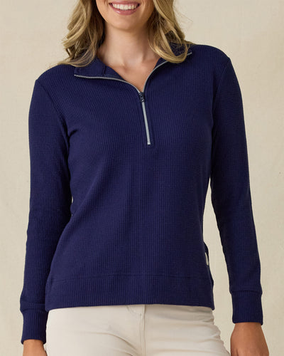 Women's Hills Quarter Zip in New Indigo, front view on model featuring a navy quarter-zip closure and waffle knit texture, styled with khaki pants