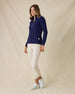 Women's Hills Quarter Zip in New Indigo, full-length side view on model featuring a navy quarter-zip closure and waffle knit texture, styled with khaki pants and white shoes