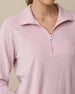 Close-up of the Collette Quarter Zip in Pink Dawn showing the soft terry cloth fabric and quarter-zip collar