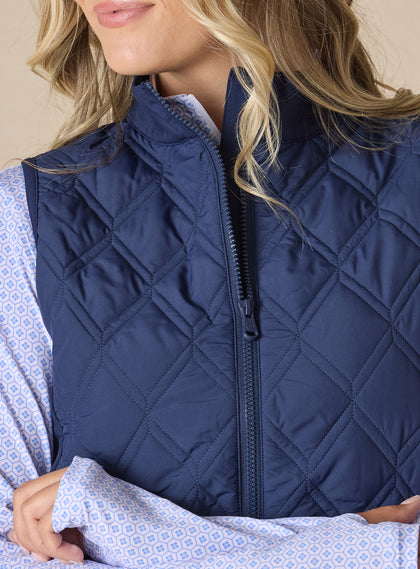 Women's Hestia Vest in New Indigo, close-up detail view of the navy quilted diamond pattern and full zip closure