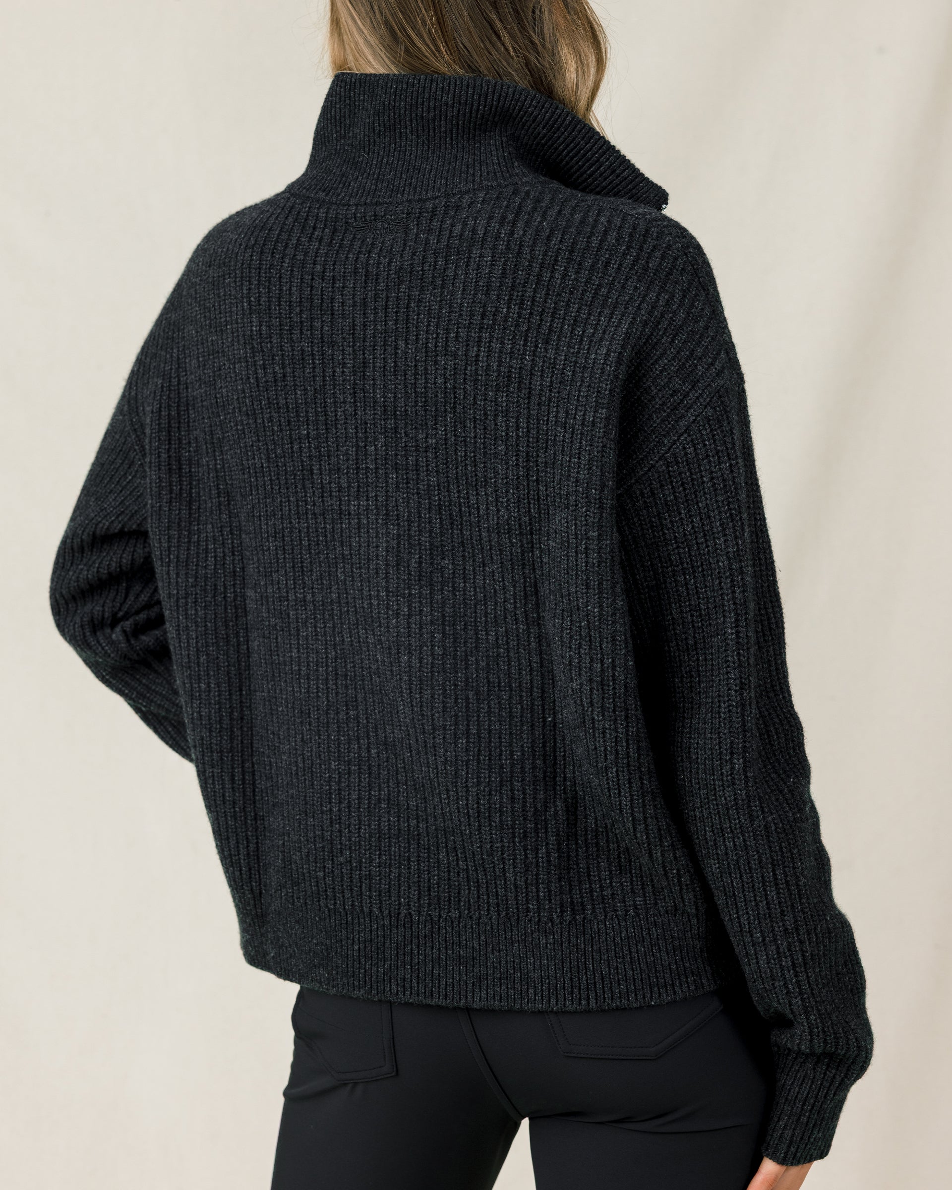 Back view of the Devon Half Zip Sweater in Charcoal, highlighting the relaxed silhouette, ribbed knit, and high collar.