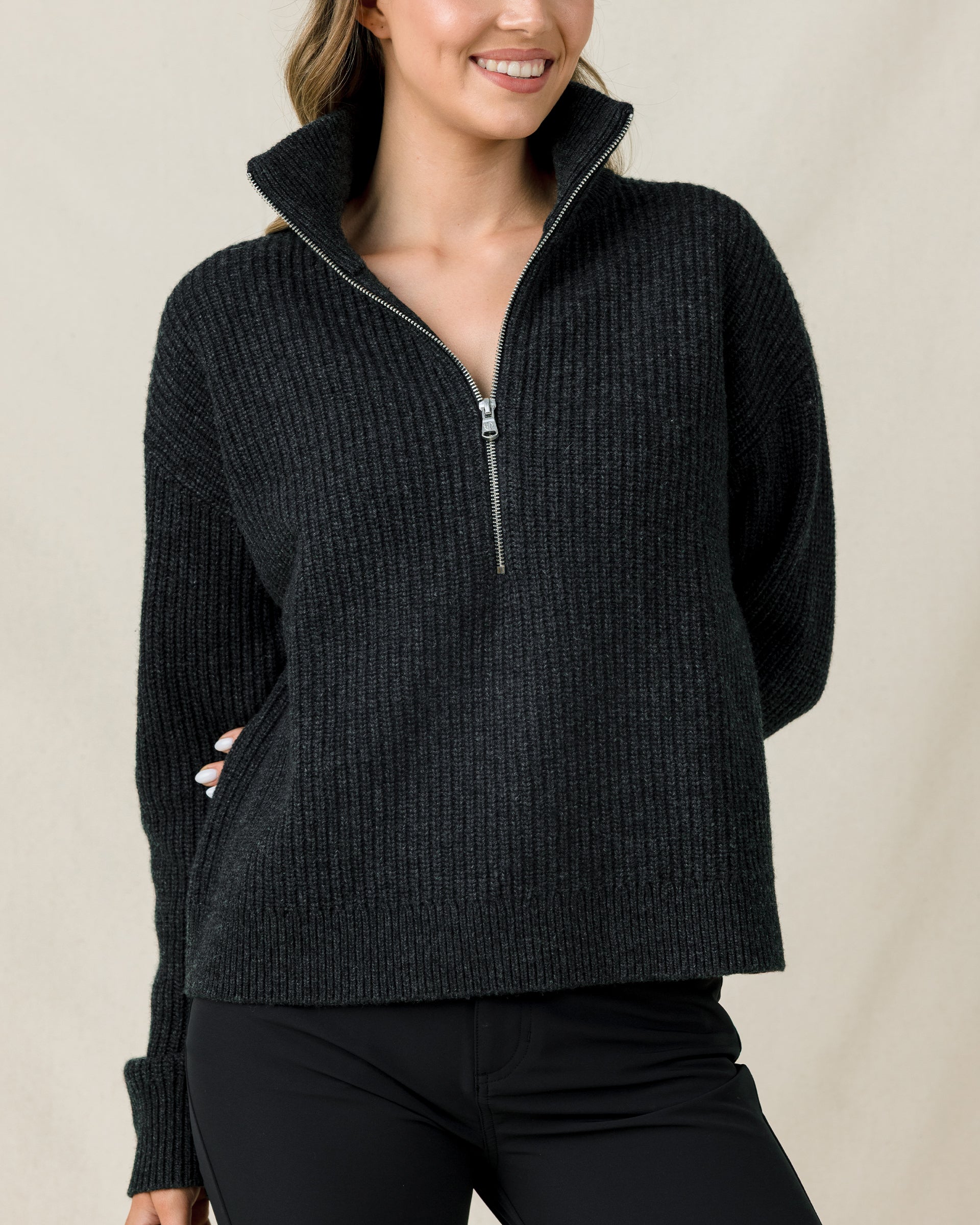 Woman wearing the Devon Half Zip Sweater in Charcoal, highlighting the relaxed fit, textured knit, and half-zip neckline.