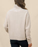 Back view of the Devon Half Zip Sweater in Oat, highlighting the relaxed silhouette, ribbed knit, and high collar.