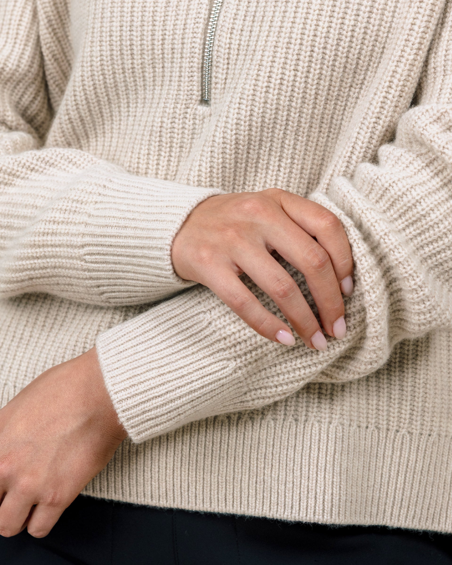 Close-up of the Devon Half Zip Sweater in Oat highlighting the textured rib knit, ribbed cuffs, and hem.