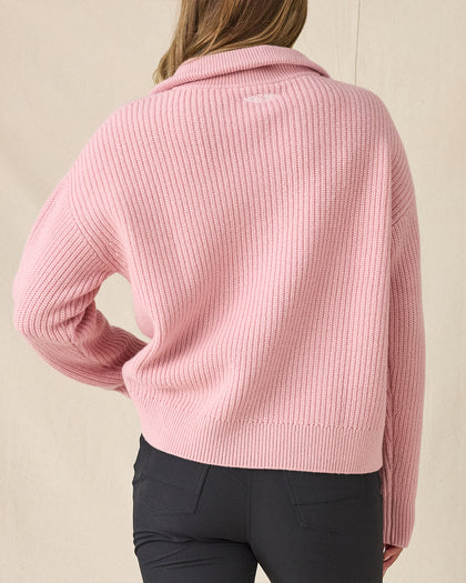 Women's Devon Half Zip Sweater in Rose, back view on model showcasing a pink ribbed knit texture and relaxed silhouette, styled with black pants