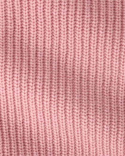 A close-up of a pink ribbed knit fabric texture, showing the detailed vertical rows of the knit pattern.