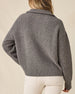 Women's Devon Half Zip Sweater in Woodland, back view on model showcasing a grey ribbed knit texture and relaxed silhouette, styled with khaki pants