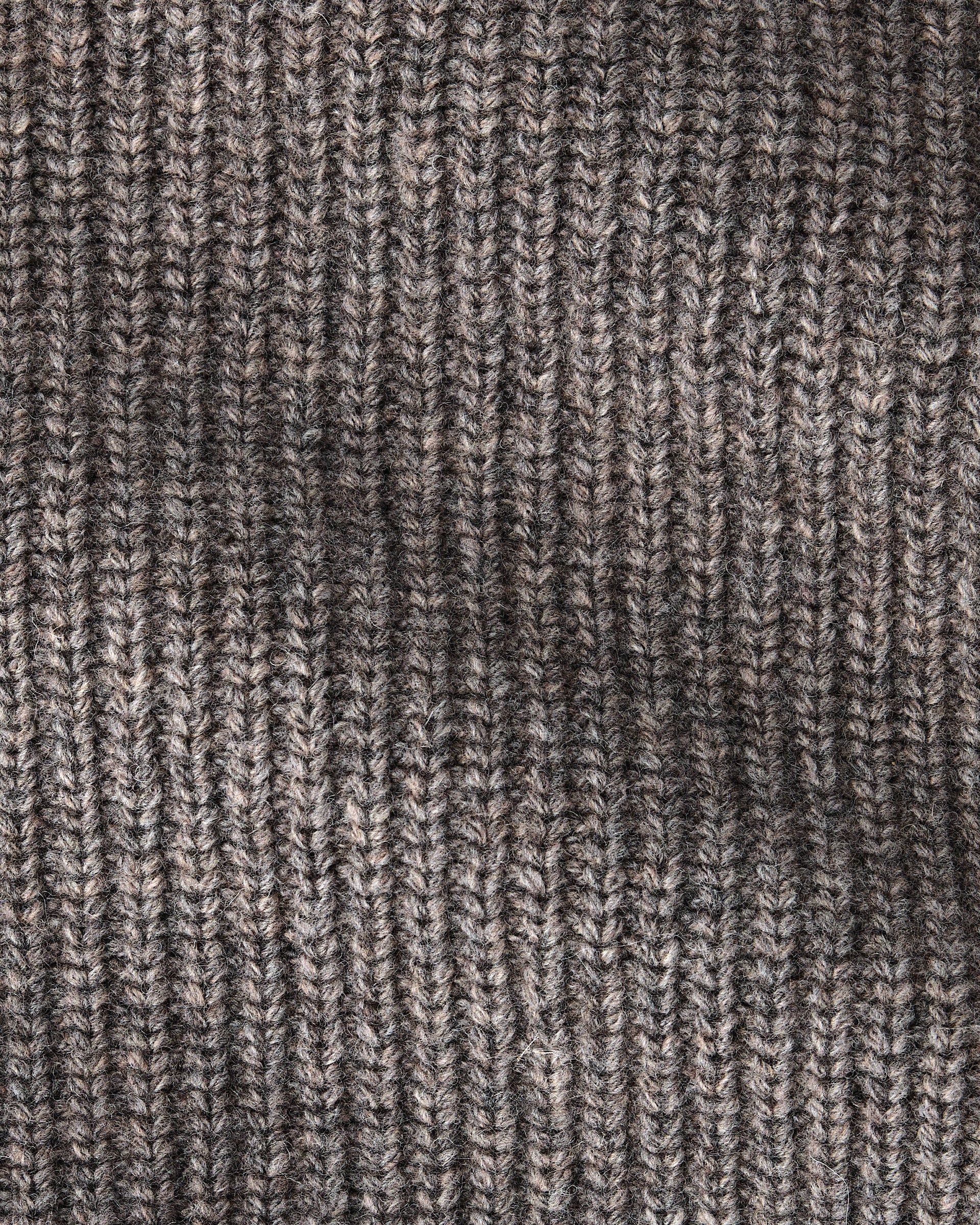 Close-up of a ribbed knit fabric in a heathered taupe-brown and gray colorway, showing the detailed texture of the yarn and stitching.